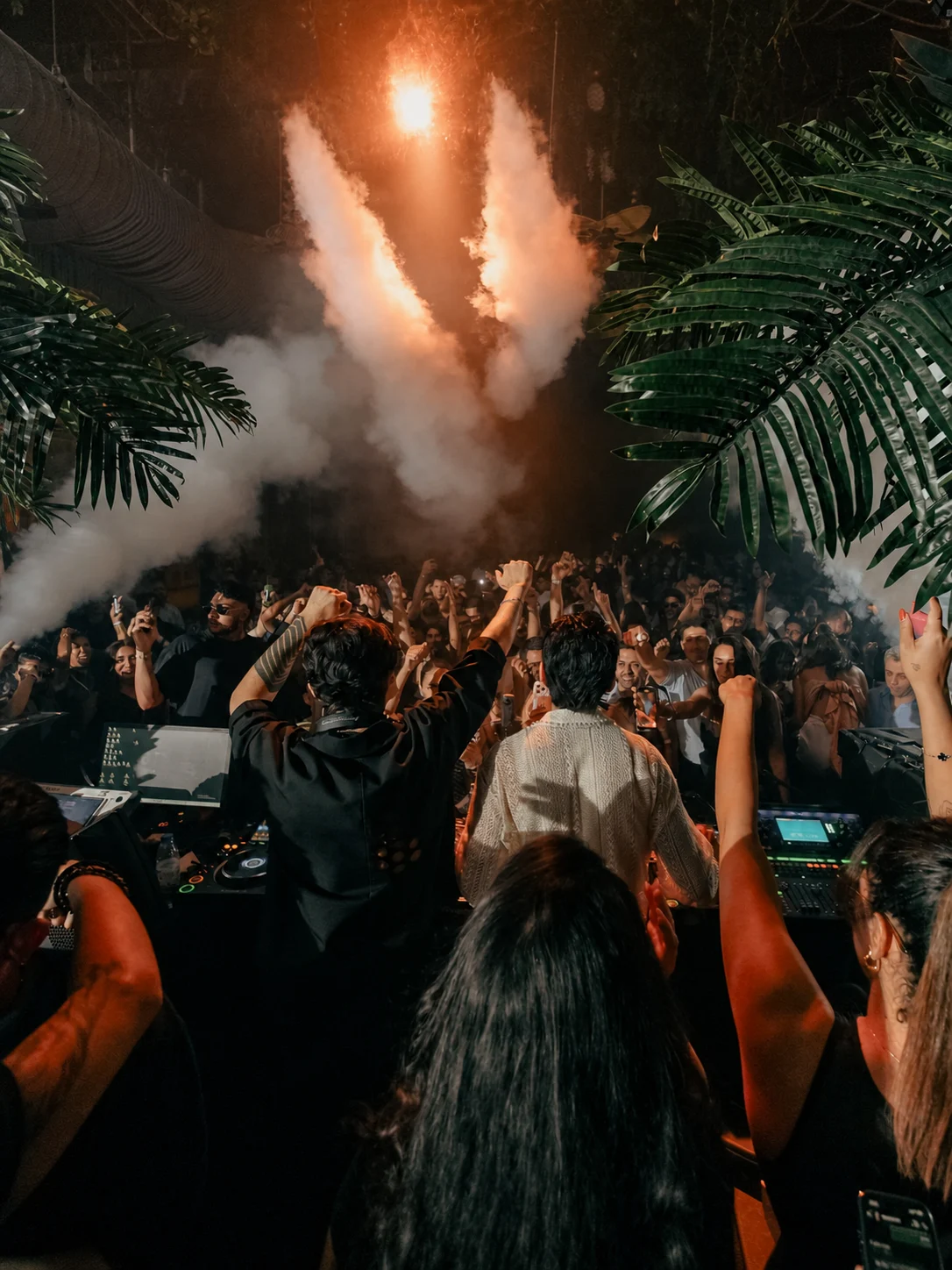 Vessbroz facing a full club crowd through stage smoke